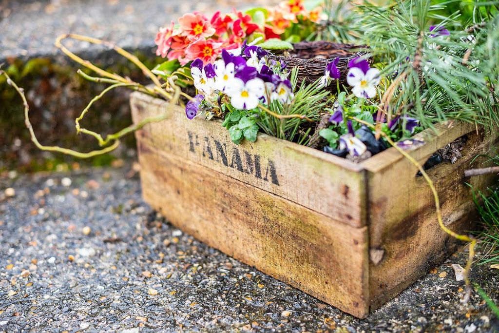 creative containers like pots, baskets, and crates for mobile gardens