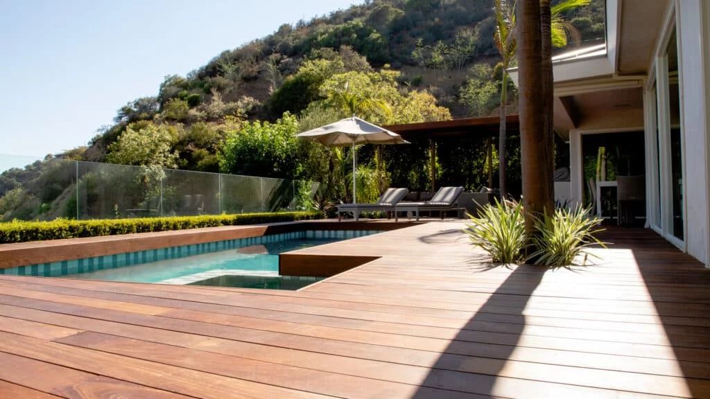 natural stone and weather-resistant woods like teak are ideal materials for coastal landscapes.