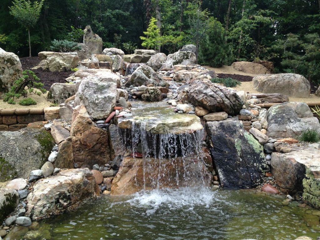 natural stones like granite and slate add elegance and durability to water features.