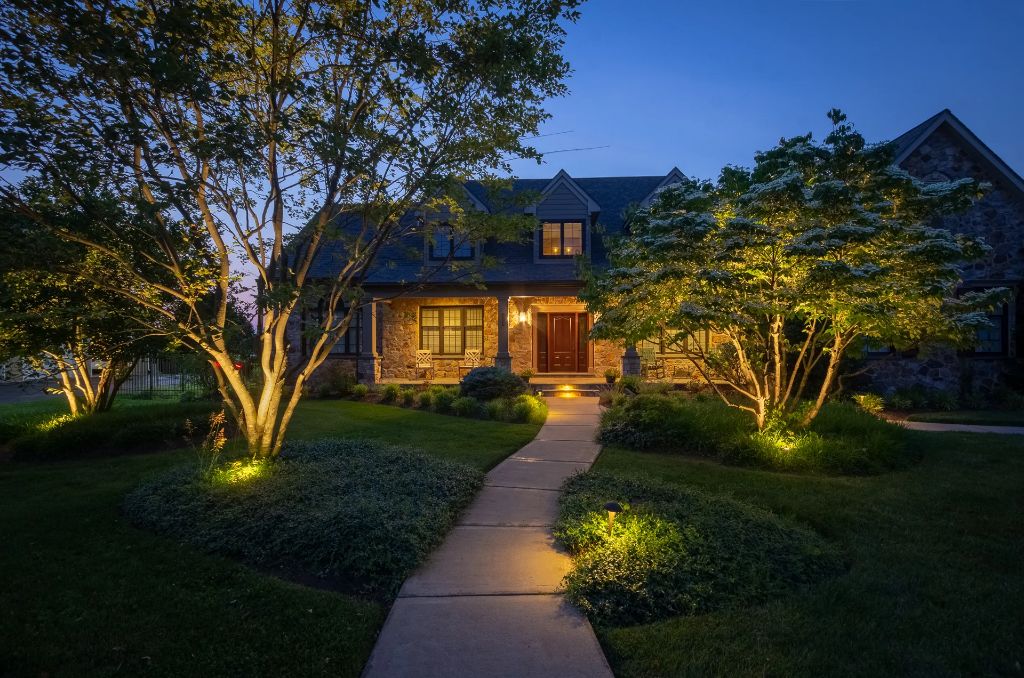 outdoor path lights and spotlights can beautifully illuminate the front yard after dusk.