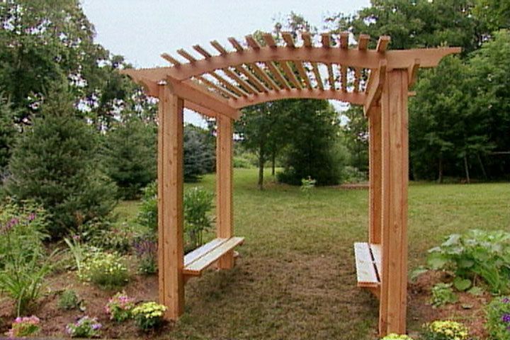 someone constructing the base of a diy garden arbor